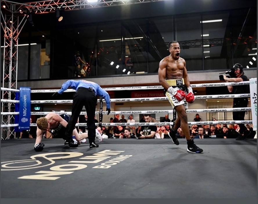 Etienne Ralph celebrating a knockdown in the ring
