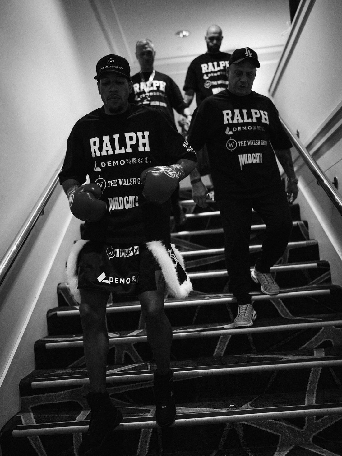 Etienne Ralph walking down to the ring with his Bondi Boxing Club corner, all in RALPH shirts